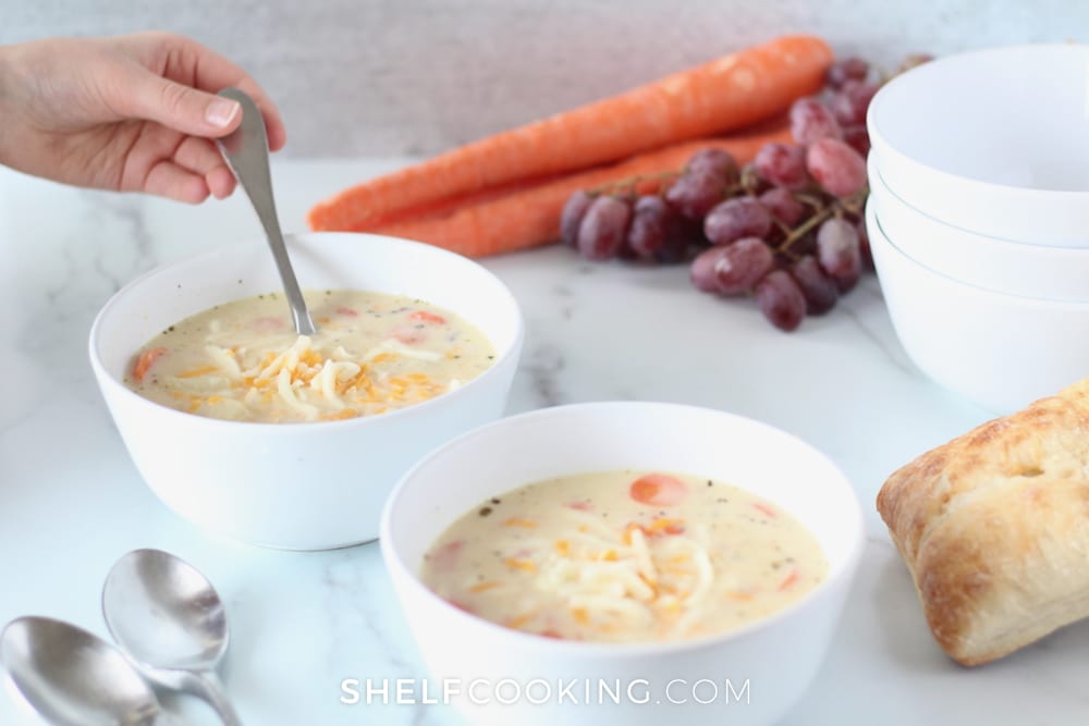 Two bowls of soup with spoons, from Shelf Cooking