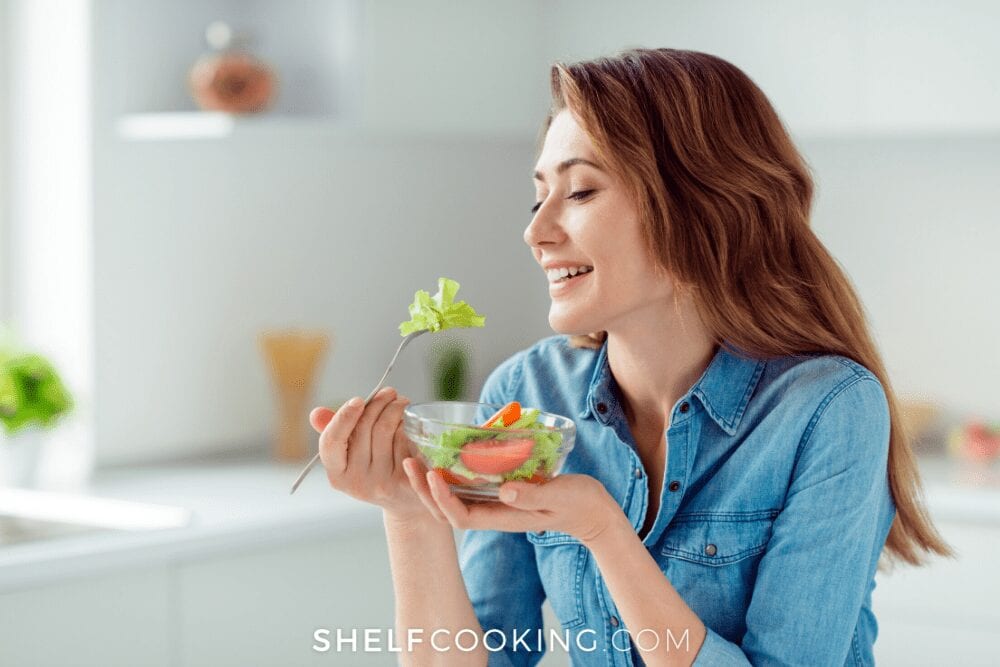 woman eating a salad, from Shelf Cooking