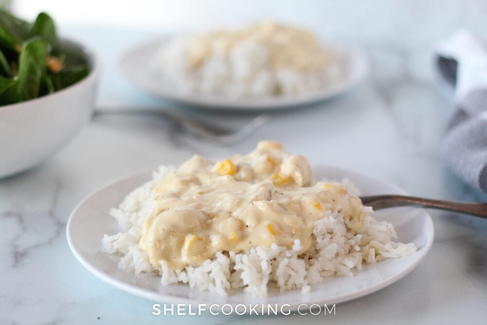 italian cream cheese chicken on rice on a white marble counter from Shelf Cooking