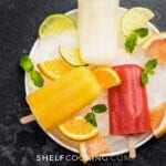 red and orange fresh fruit popsicles, from Shelf Cooking