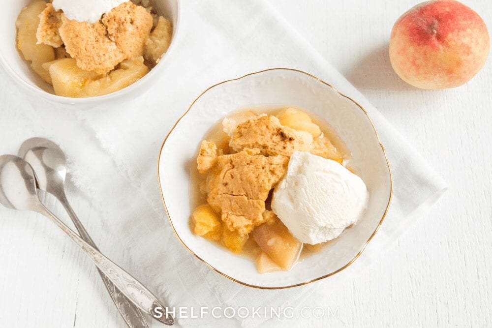 two bowls of peach cobbler, from Shelf Cooking