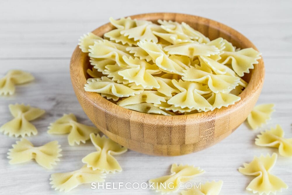 Dried bowtie pasta in a bowl, from Shelf Cooking 