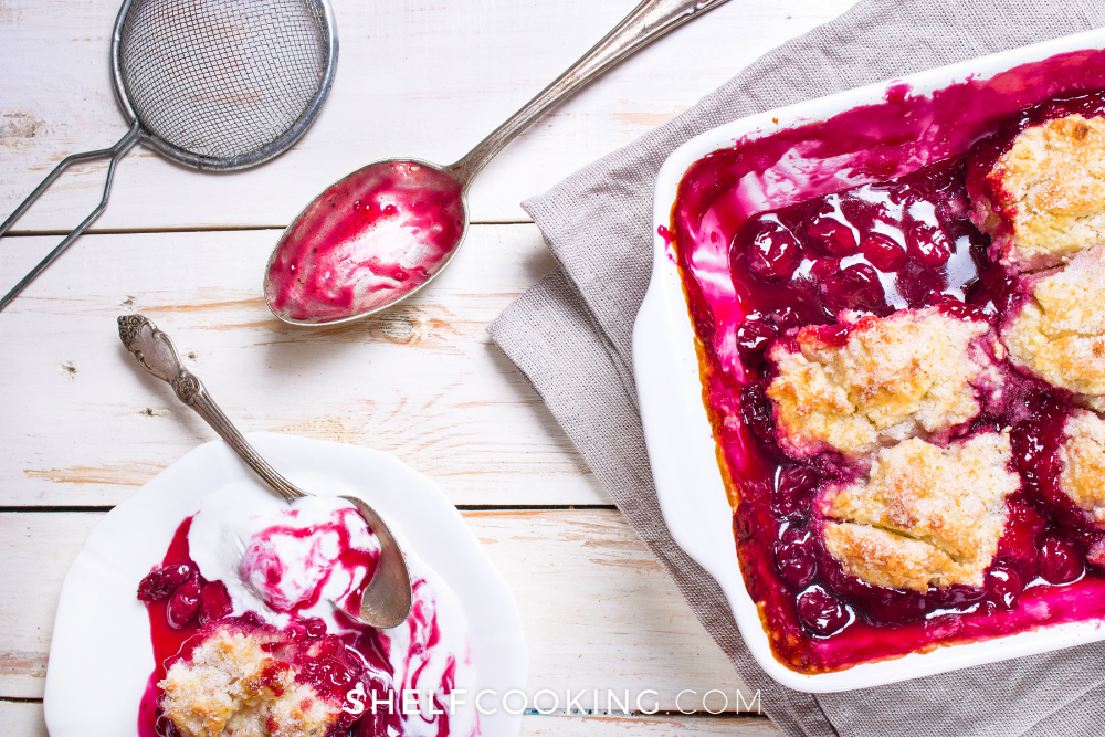 berry cobbler in a dish with ice cream from Shelf Cooking 