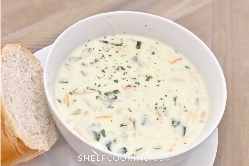 bowl of creamy chicken soup with bread, from Shelf Cooking