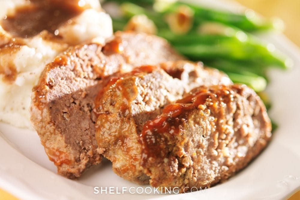 Meatloaf and mashed potatoes on a plate from Shelf Cooking. 