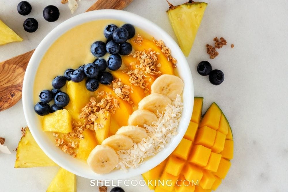 homemade mango pineapple smoothie bowl, from Shelf Cooking
