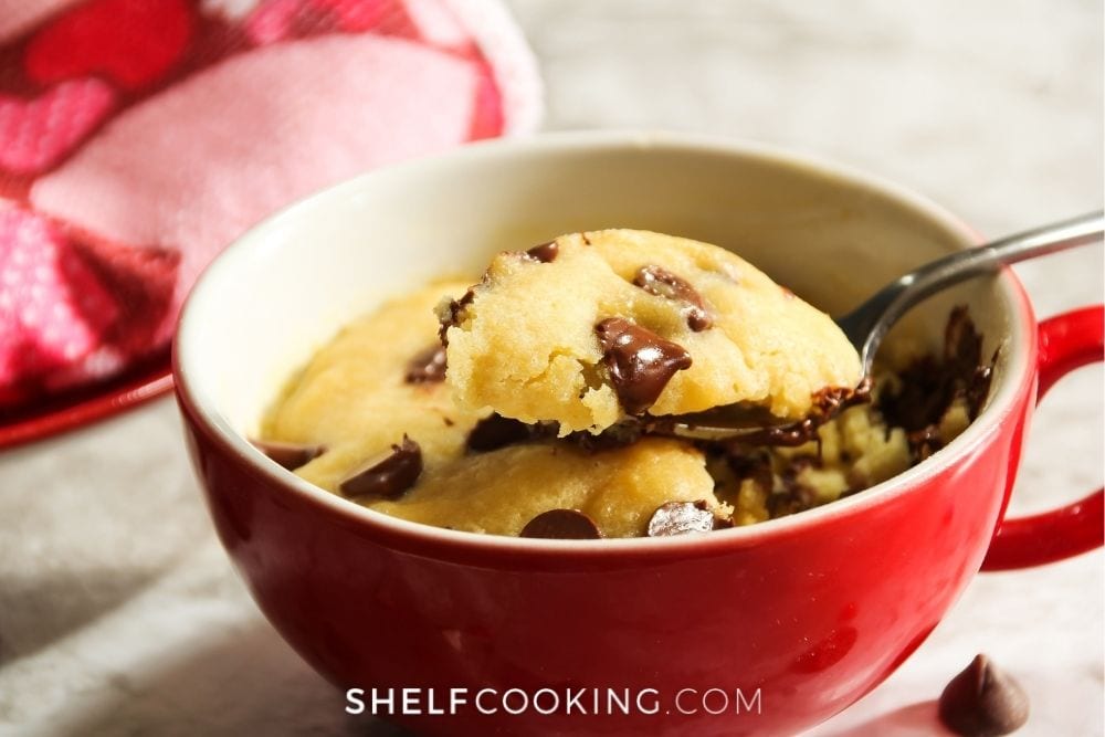 Chocolate chip cookie in a mug from Shelf Cooking. 