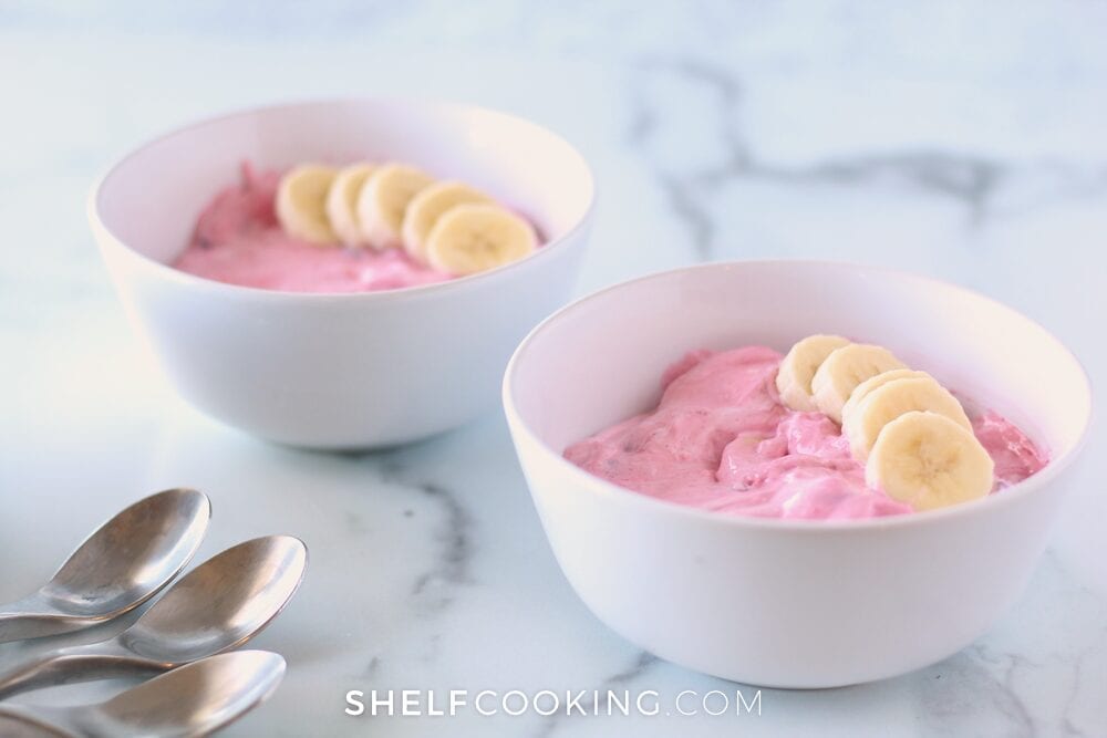 Creamy fruit salad in a bowl from Shelf Cooking. 