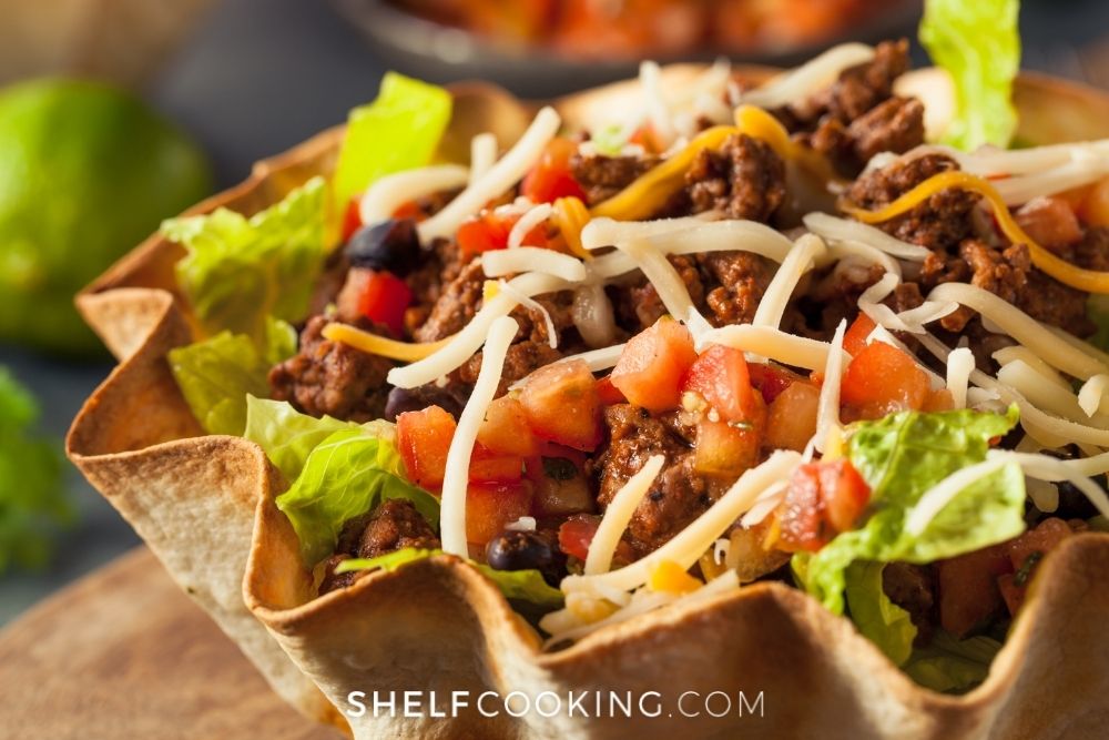 Taco salad in a tortilla shell from Shelf Cooking. 
