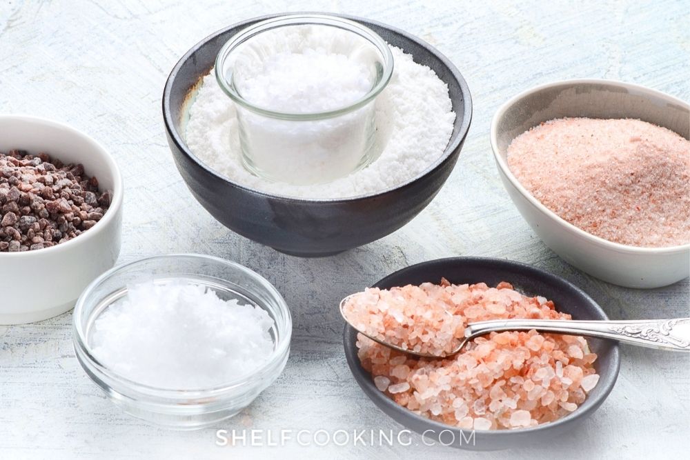 Different types of salt in bowls from Shelf Cooking. 