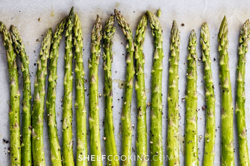 Asparagus on a baking sheet from Shelf Cooking. 