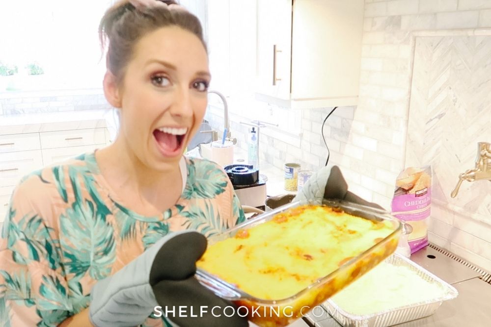 Jordan Page holding tamale casserole, from Shelf Cooking