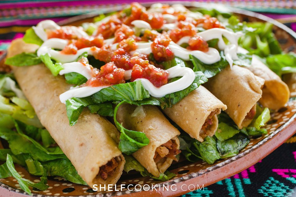 Pork taquitos on a platter from Shelf 
Cooking. 