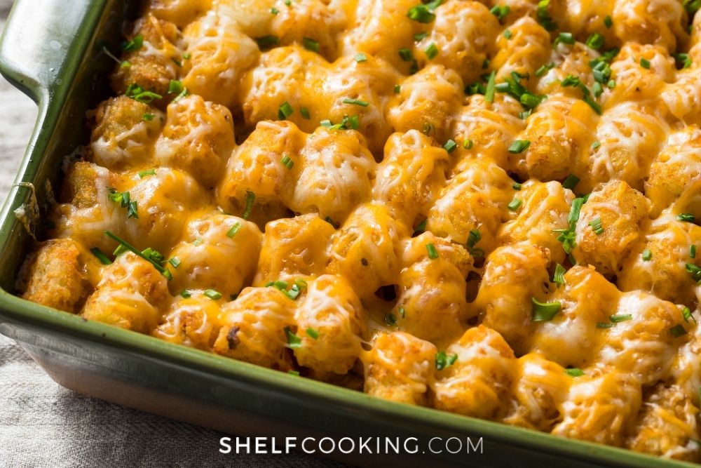 Tater tot casserole in a pan from Shelf Cooking. 