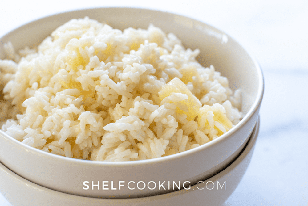 White bowl filled with pineapple rice. - Shelf Cooking