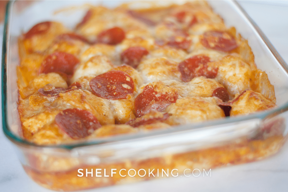 Image of a 9x13 pan of pepperoni pizza casserole. - Shelf Cooking